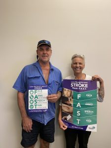 Stroke advocate and Metanoia Rays participant Richard Crookes with Metanoia Rays Operations Manager Raelene McAdam holding poster with the 'FAST' Stroke awareness message.
